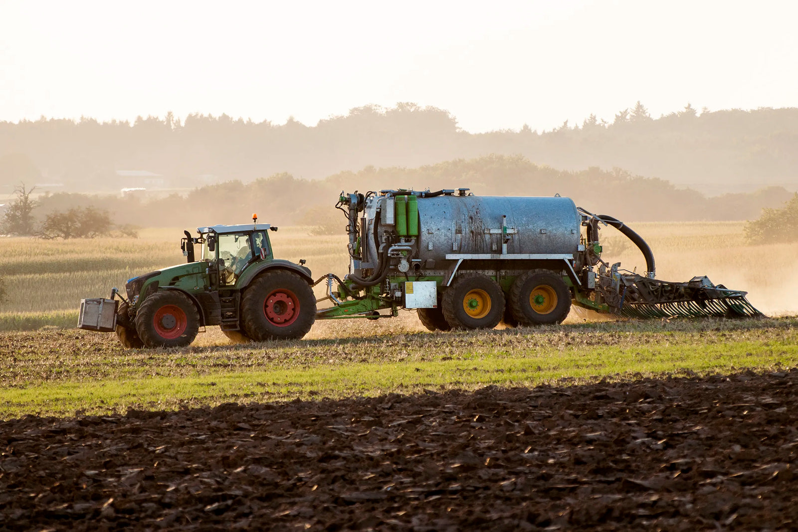 Tractor working on agricultural farmland