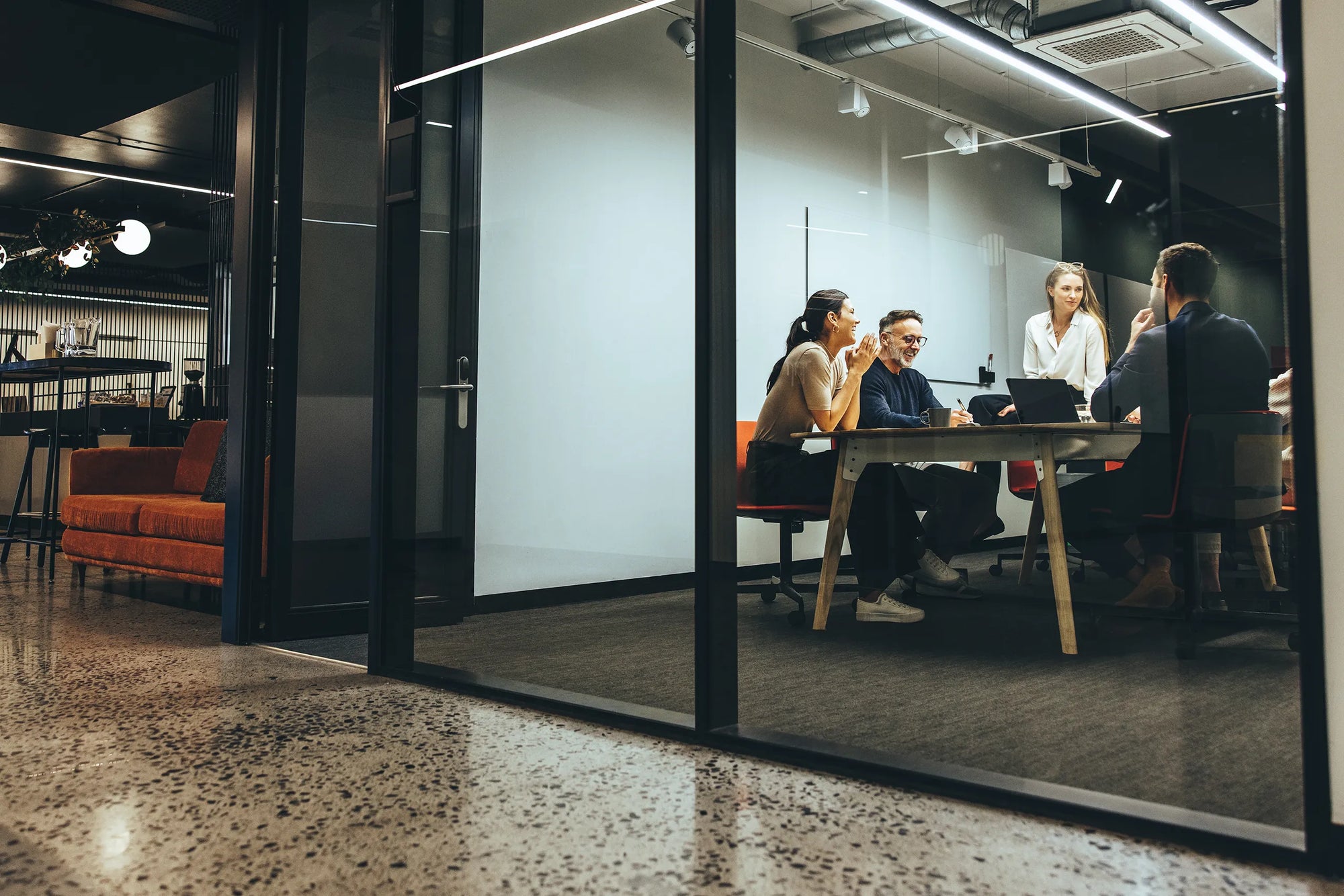 Business professionals in corporate office meeting room